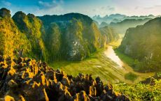 Hiking up top of Mua Cave